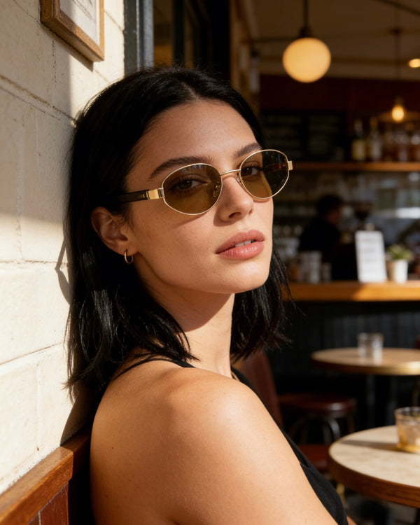 Pink Baby Hollis Tort sunglasses with stylish rounded frames and tinted lenses, perfect for a fashionable look.