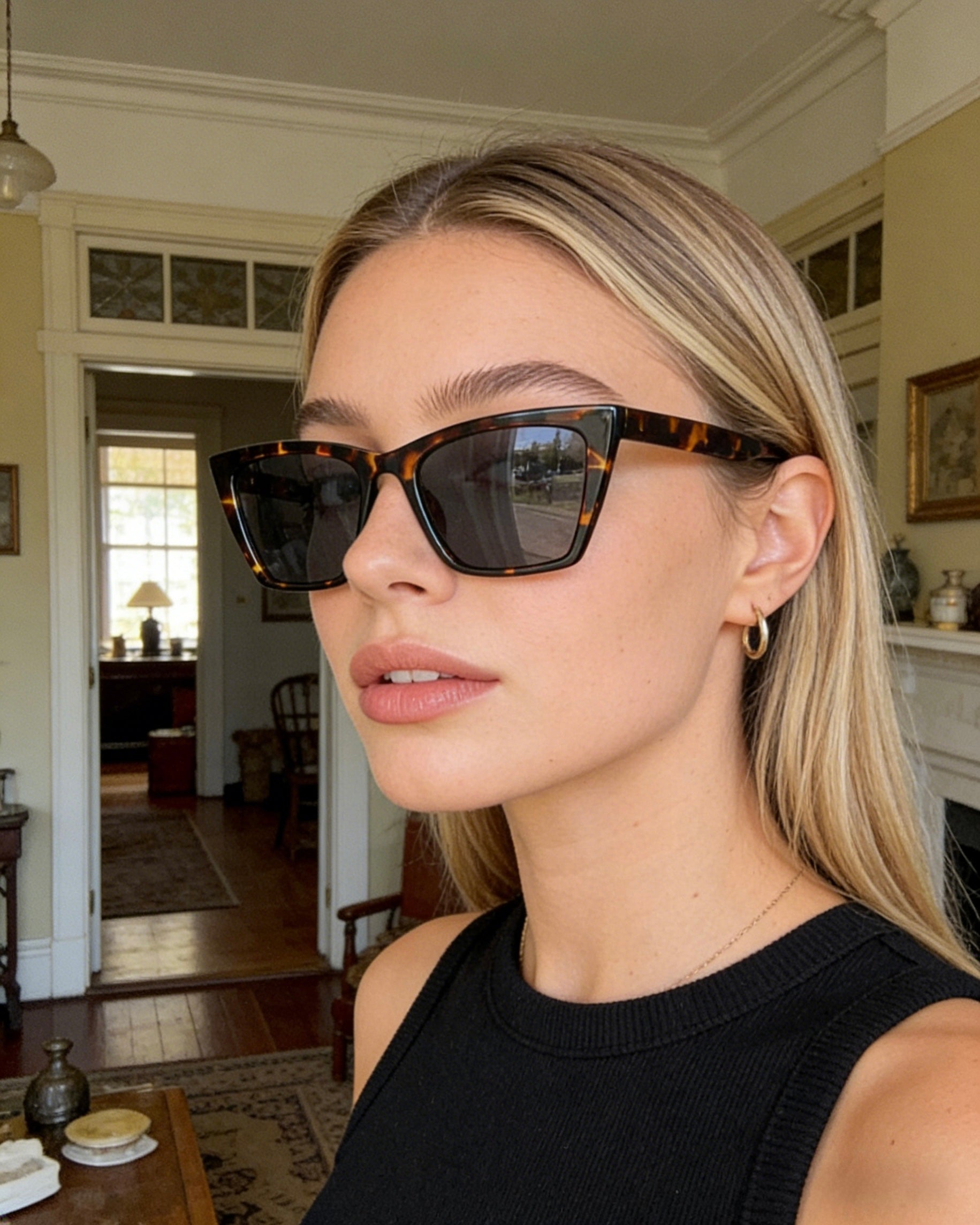 Pink Baby The Levi sunglasses with black frames and dark tinted lenses, stylish eyewear for sun protection.
