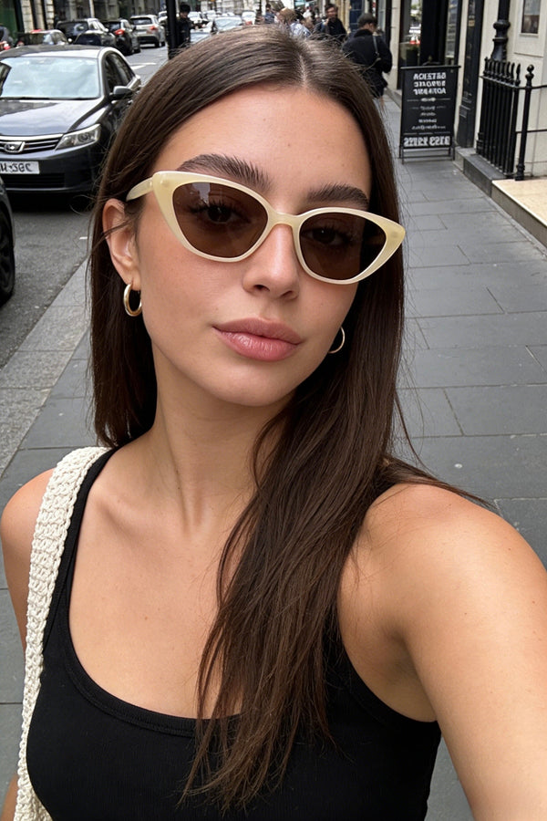 Pink Baby The Juno lemon sunglasses with yellow tinted lenses and a stylish frame, perfect for sun protection and fashion.