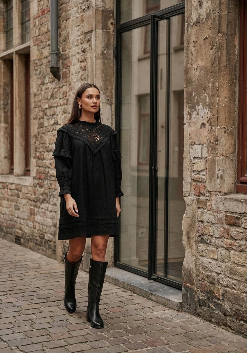 Black Elisabetta embroidered yoke mini dress by Pink Baby, showing intricate embroidery and a fitted silhouette.