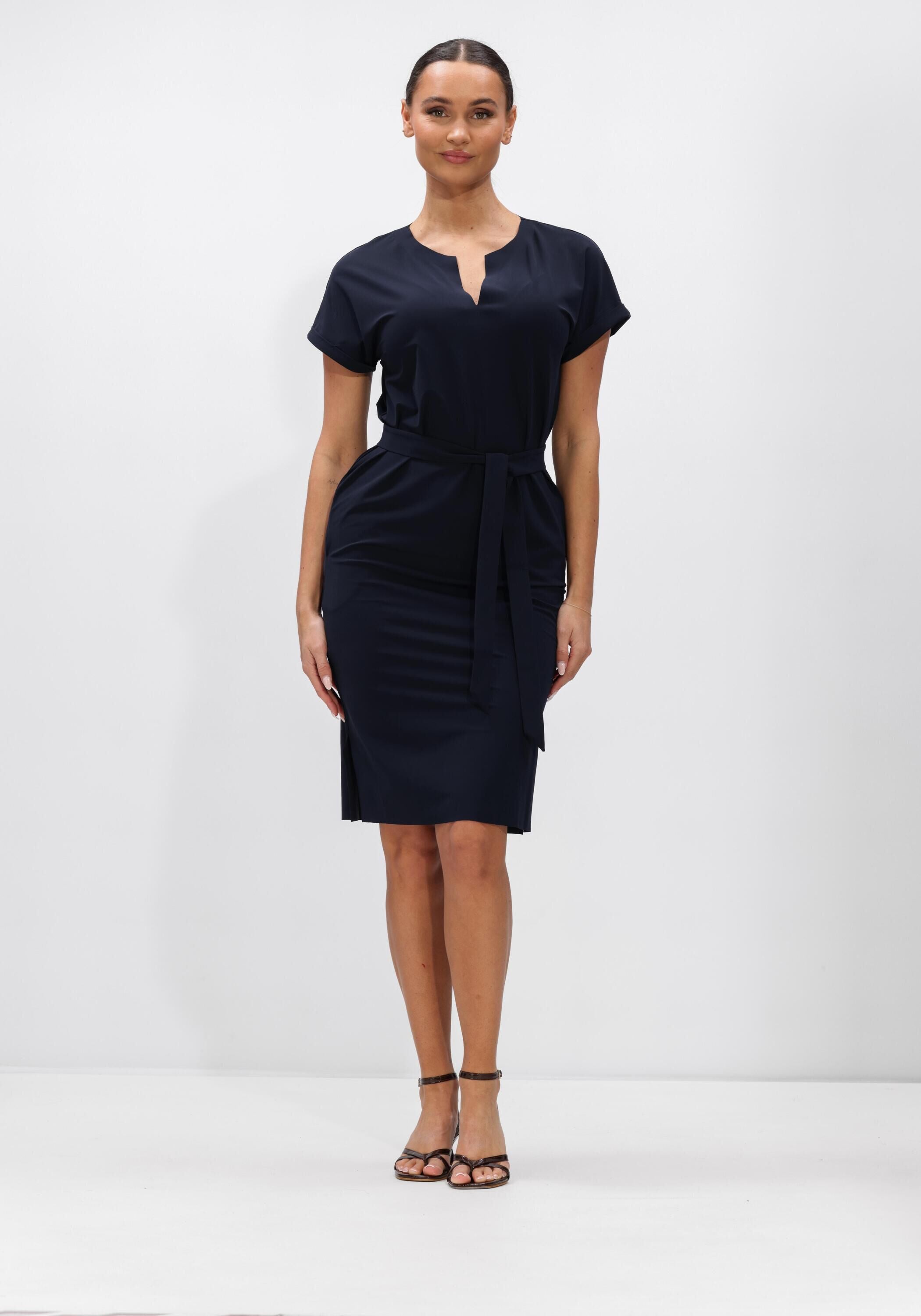 Pink Baby Serena belted notch-neck navy midi dress displayed on a hanger, featuring a belted waist and notch neckline.