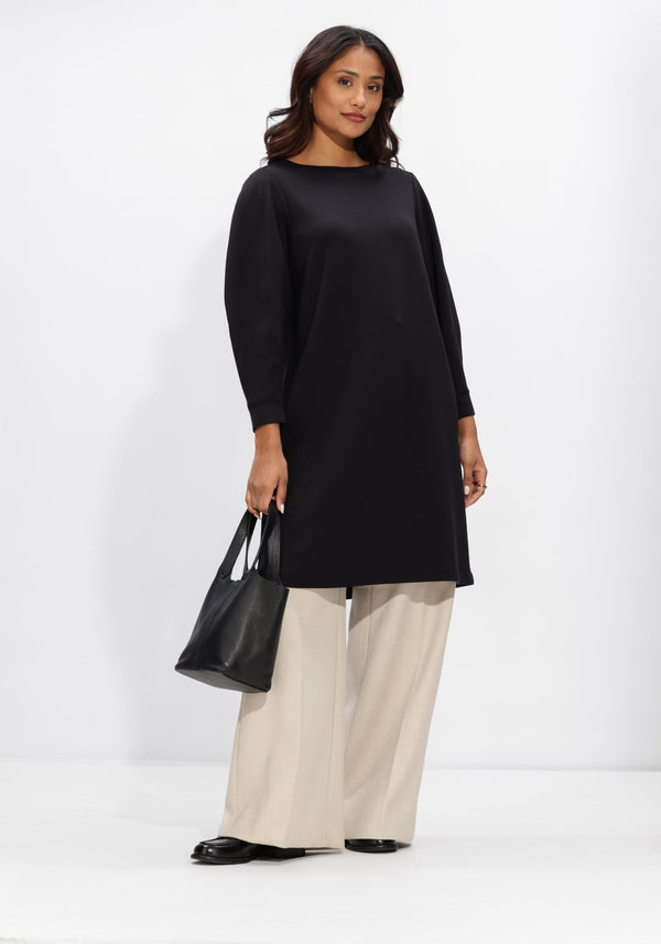 Pink Baby Helena long-sleeve shift dress in black, showcasing the elegant, fitted design and smooth fabric.