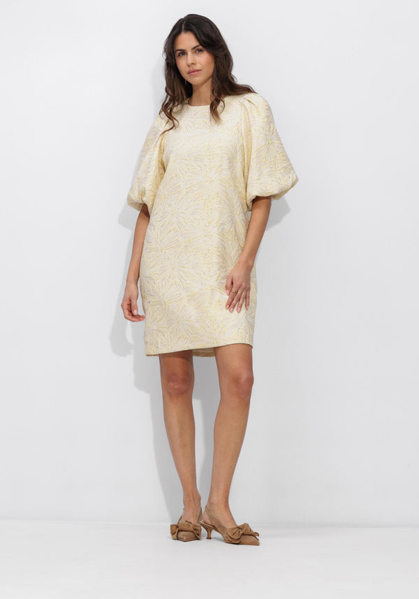 Cream Sabelle textured puff sleeve mini dress by Pink Baby, featuring a fitted bodice and puffed sleeve details.
