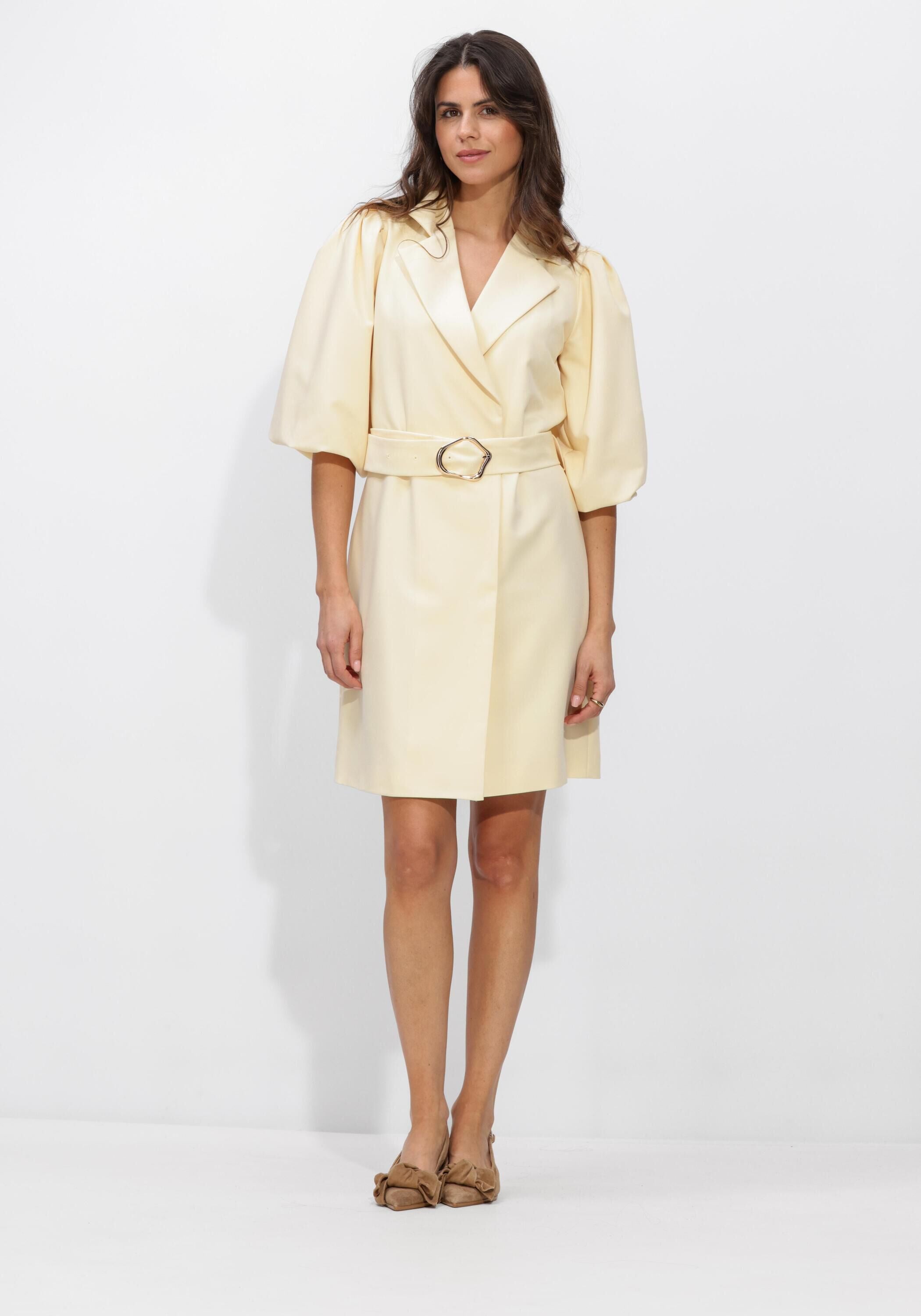 Pink Baby Aurora belted blazer mini dress in butter yellow, featuring a tailored fit and stylish design on a model.
