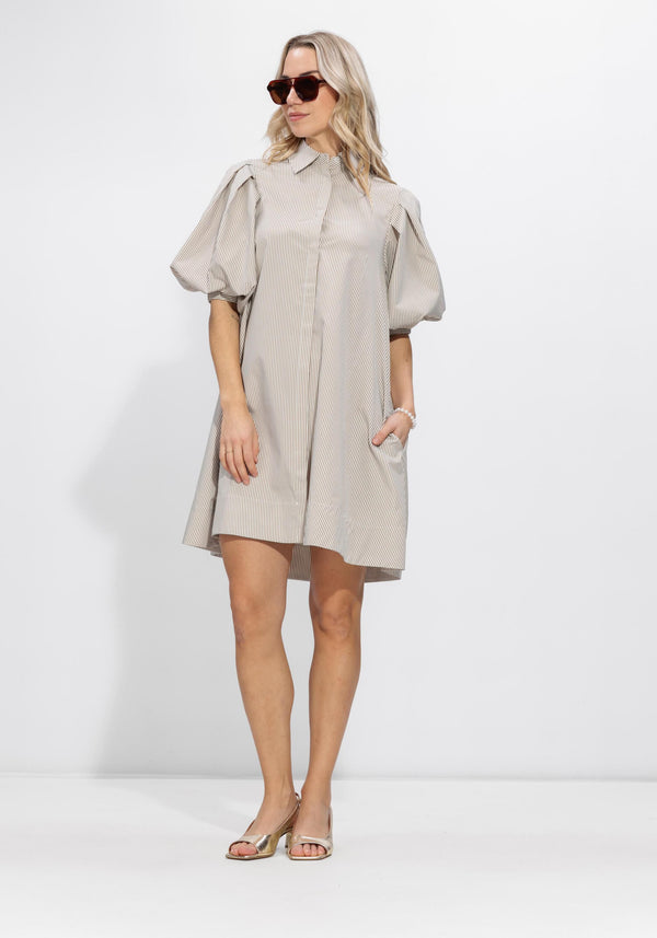Pink Baby Arabel striped puff sleeve shirt dress in taupe with vertical stripes and a relaxed fit, displayed on a hanger.