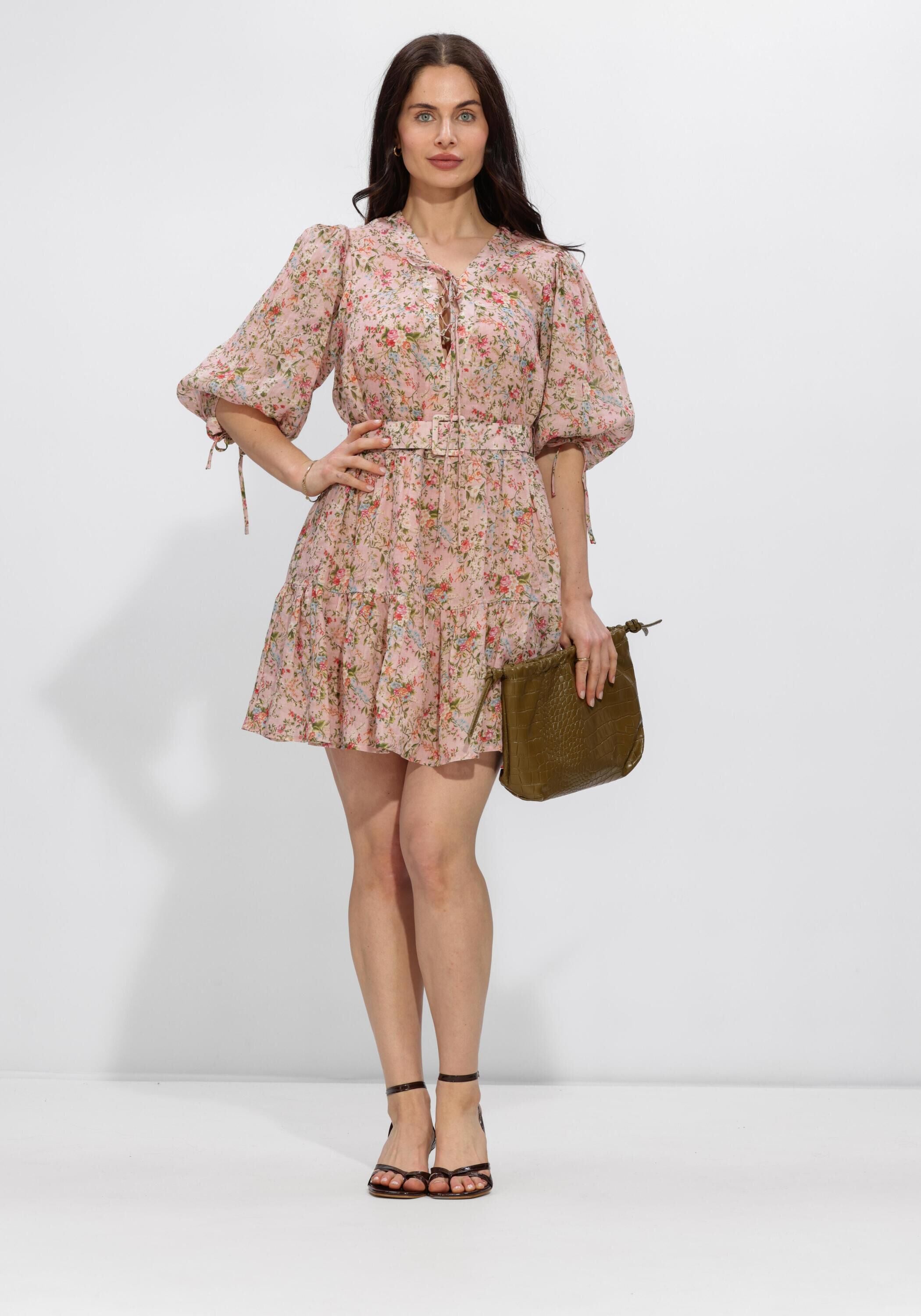 Pink Baby Eloisa floral mini dress in blush pink with a belted waist, featuring a feminine floral pattern and sleeveless design.
