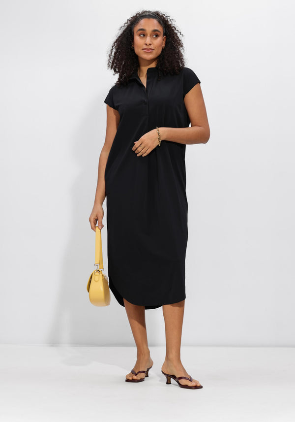 Pink Baby Alexa relaxed polo midi dress in black, featuring a casual polo collar and knee-length design, shown on a model.