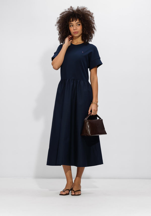 Pink Baby Allegra gathered midi dress in midnight navy, showcasing the elegant, flowy fabric and gathered waist design.