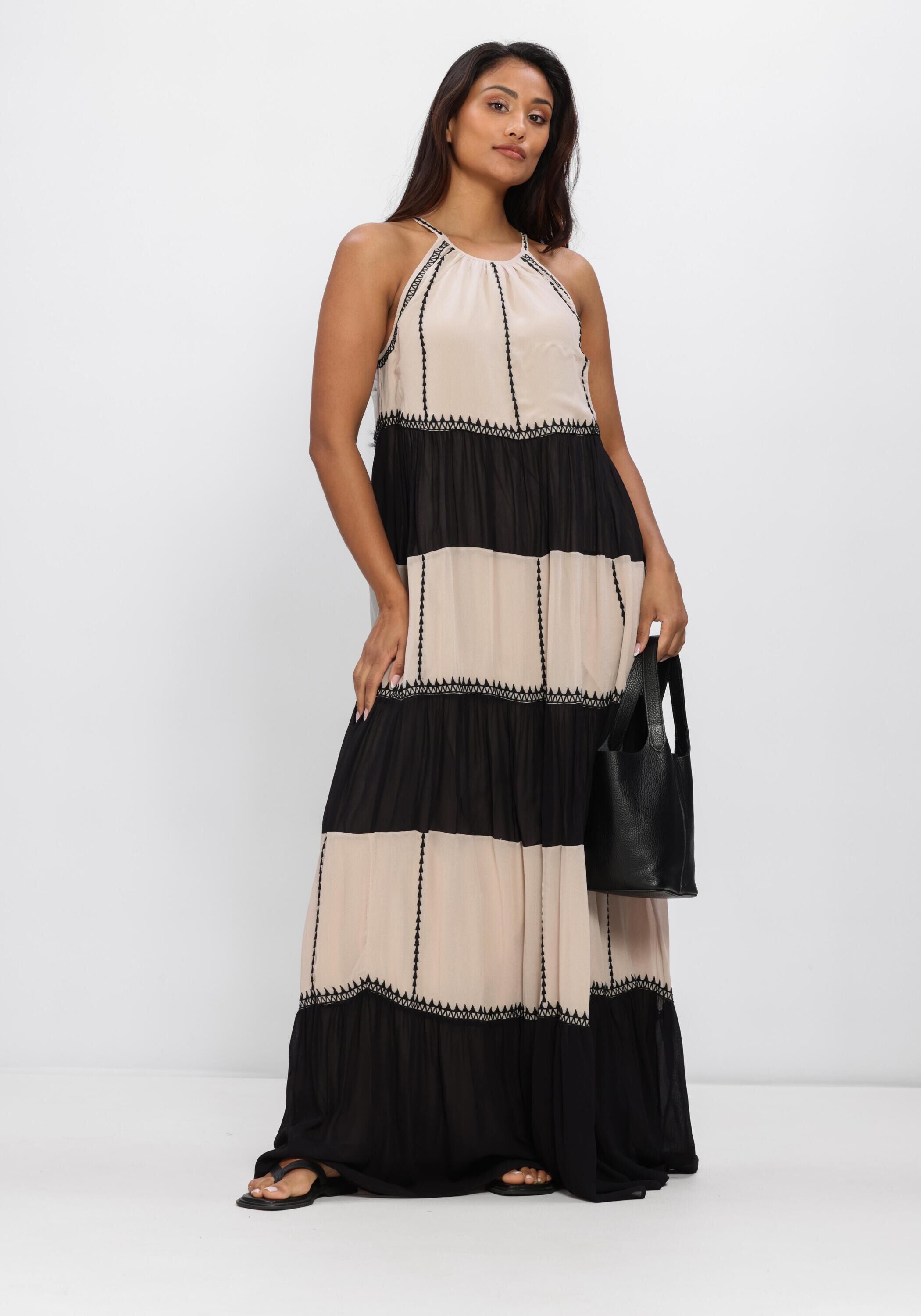 Beige and black Adorn Tassel-Tie Tiered Maxi Dress by Pink Baby, featuring tassel ties and a tiered flowing design.