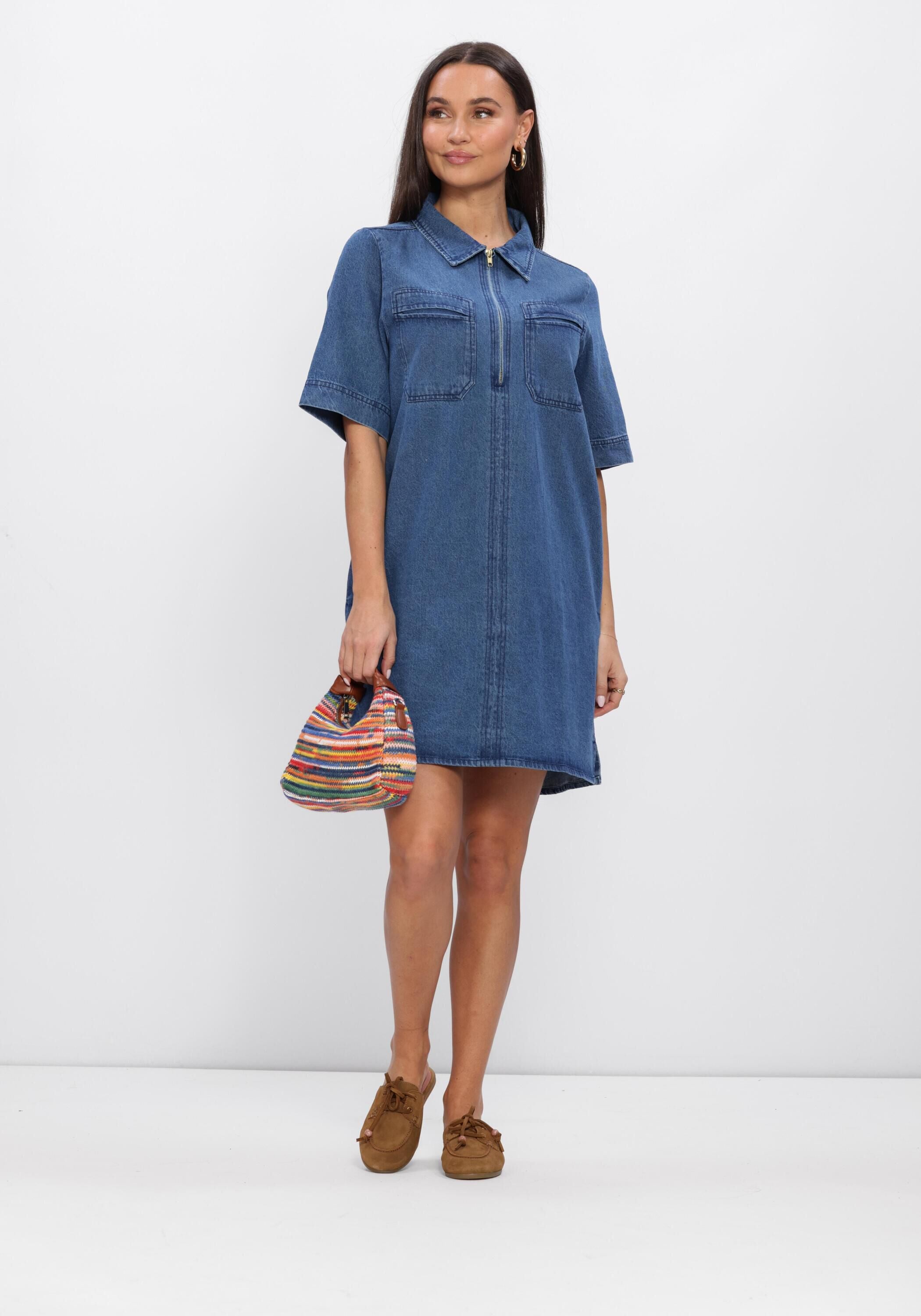 Pink Baby Senie zip-front denim mini dress in mid blue, featuring a stylish short design and front zipper, on a white background.