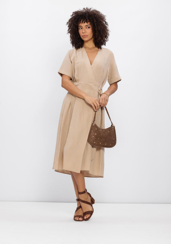 Beige Camille Buckle Wrap Midi Dress by Pink Baby, featuring a stylish wrap design and buckle accents on a model.