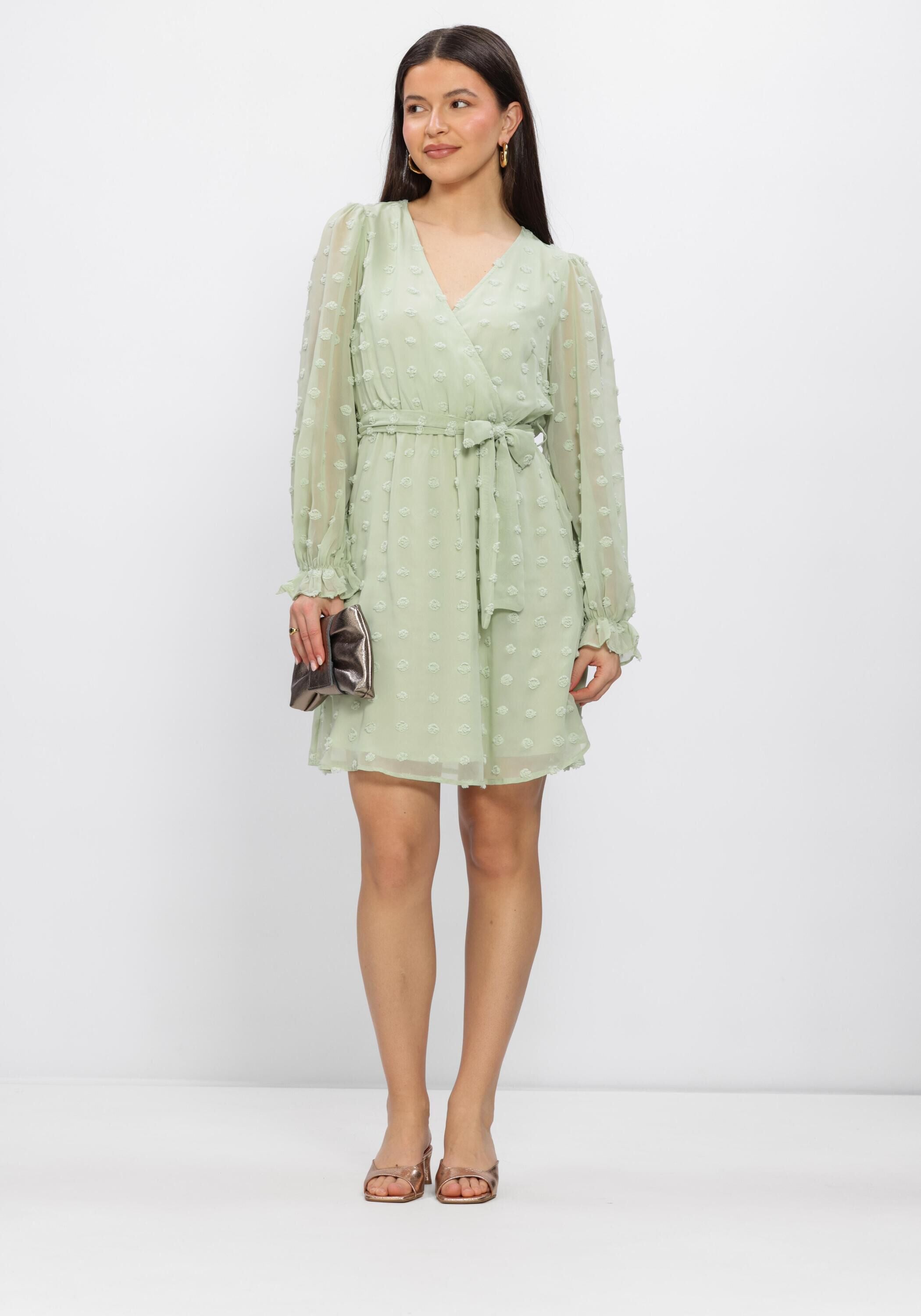 Pink Baby Elodia Dobby Wrap Mini Dress in sage green, featuring a stylish wrap design and mini length.
