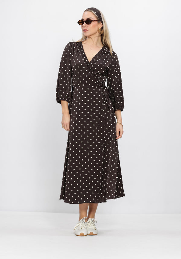 Pink Baby Vivi polka dot wrap midi dress in chocolate brown, featuring a flattering silhouette and long sleeves.