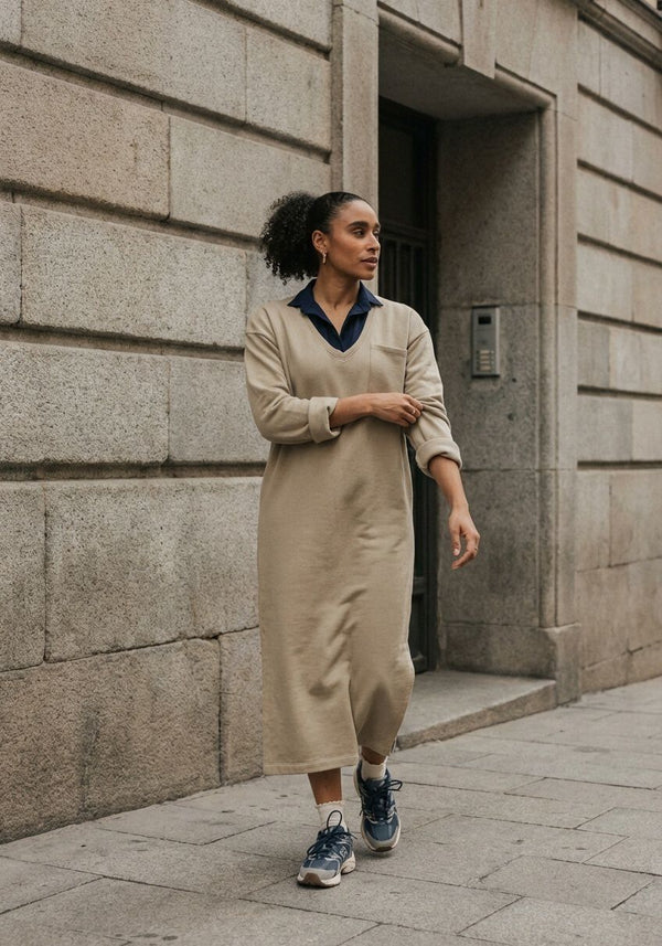 Pink Baby Elaine relaxed v-neck midi dress in sand beige, flowing fabric with short sleeves and a relaxed fit.