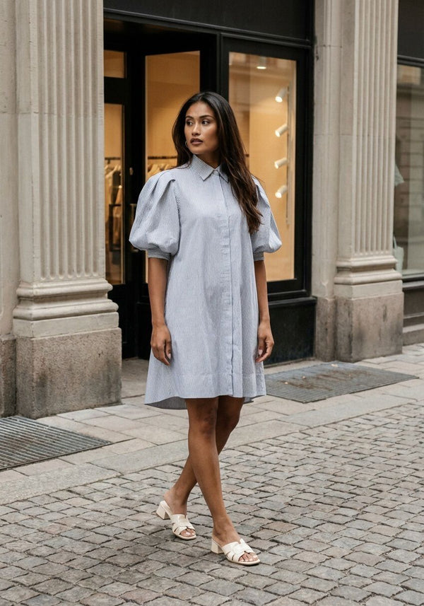 Pink Baby Adelina striped puff-sleeve shirt dress in white and black, featuring a classic fit and stylish design.