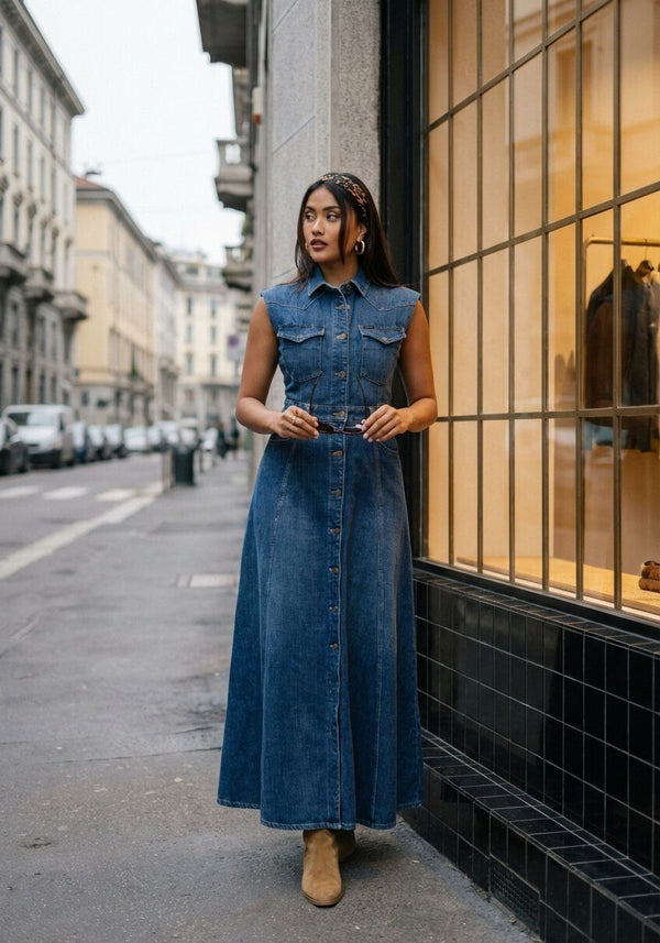 Pink Baby Genevieve belted denim maxi dress in dark blue, featuring a fitted waist, long sleeves, and flowing length.