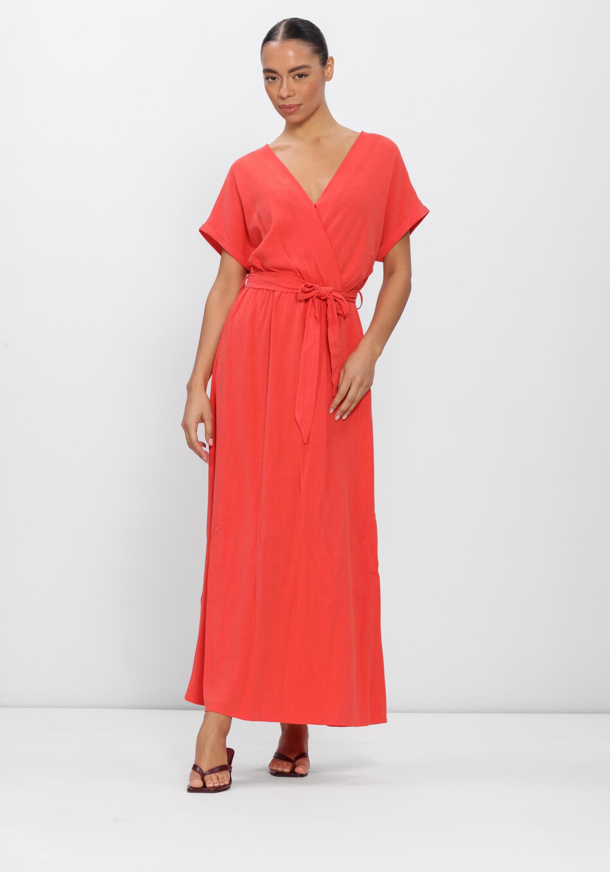 Pink Baby Alina Belted Wrap Maxi Dress in coral, featuring a flowy silhouette and waist belt, displayed on a mannequin.