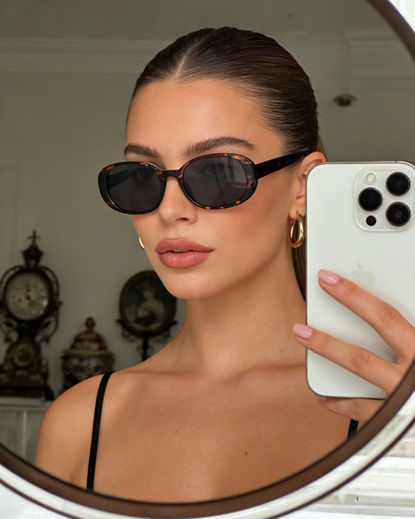 Pink Baby Miller sunglasses with tinted lenses and a stylish frame, perfect for sunny outdoor wear.