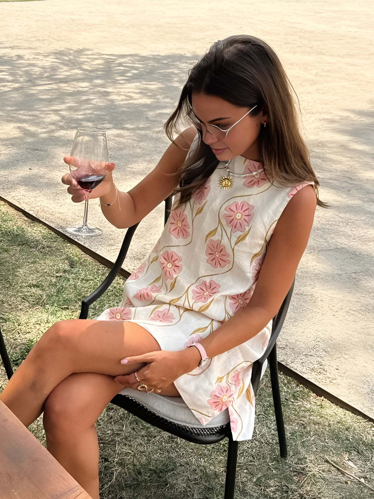 Pink Baby romantic print sleeveless short dress with floral pattern, lightweight fabric, and a flattering fit for warm weather.