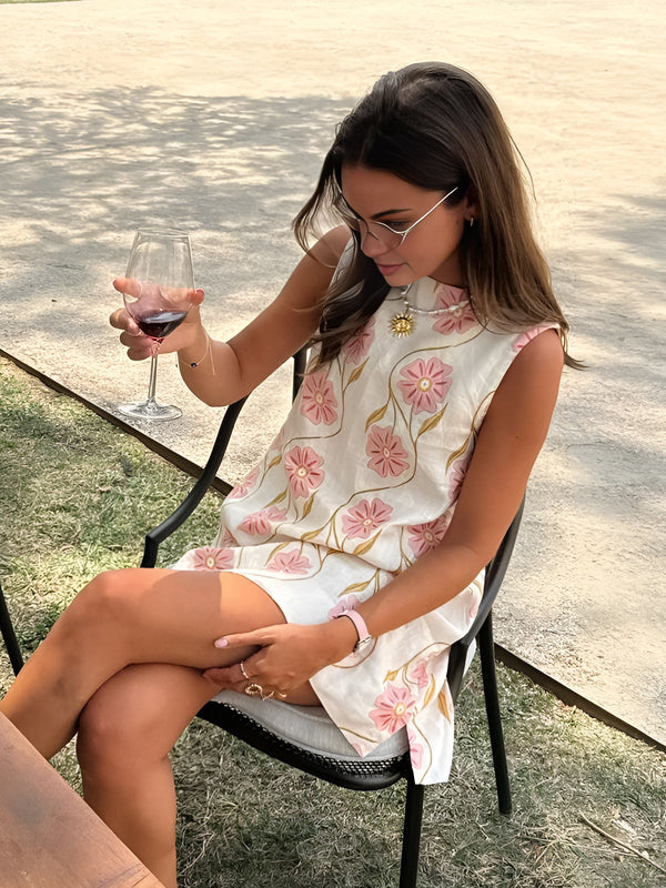 Pink Baby romantic print sleeveless short dress with floral pattern, lightweight fabric, and a flattering fit for warm weather.
