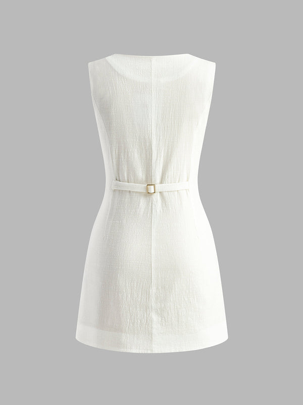 Pink Baby cotton button-front short dress with short sleeves and a fitted waist, displayed on a hanger.