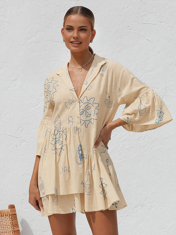 Pink Baby oversized sun print short dress showing a relaxed fit with a vibrant sun pattern on lightweight fabric.