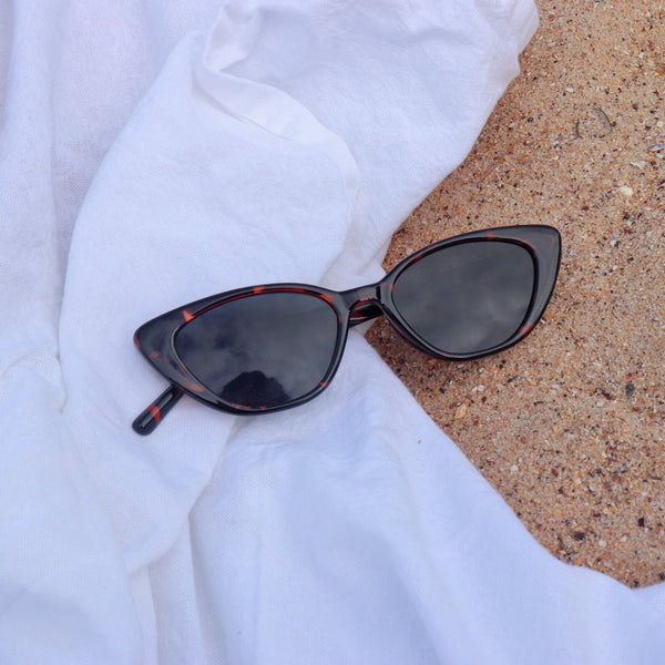 Pink Baby The Juno tort sunglasses with rounded frames and dark lenses, stylish eyewear for sun protection.