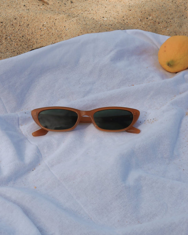Pink Baby The Indie pumpkin-shaped sunglasses with orange tinted lenses and playful design for kids.