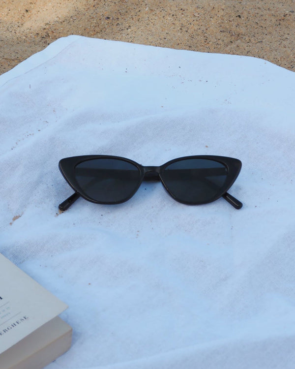 Pink Baby Juno black sunglasses with sleek frames and tinted lenses, stylish eyewear for sun protection.