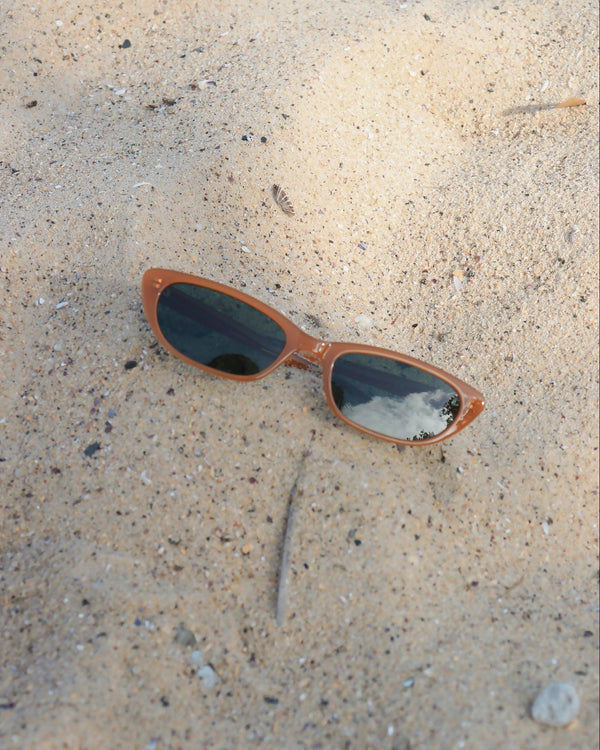 Pink Baby The Indie pumpkin-shaped sunglasses with tinted lenses and stylish frame, perfect for a fun, fashionable look.