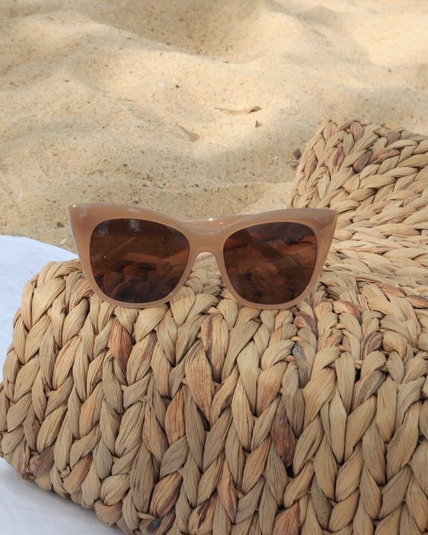 Pink Baby The Rylee cinnamon sunglasses with round frames and tinted lenses, stylish eyewear for sunny days.