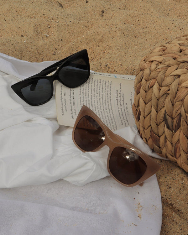 Pink Baby Rylee black sunglasses with sleek frames, stylish design, and tinted lenses for sun protection.