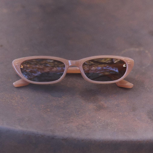 Pink Baby The Indie cinnamon sunglasses with round frames and tinted lenses, stylish eyewear for sun protection.