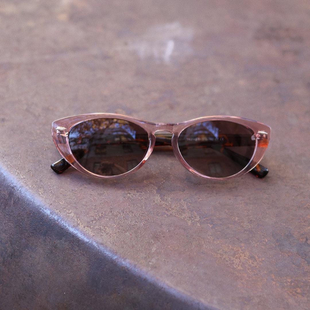 Pink Baby The Bailey pink sunglasses with rounded frames and tinted lenses, stylish eyewear for trendy fashion.