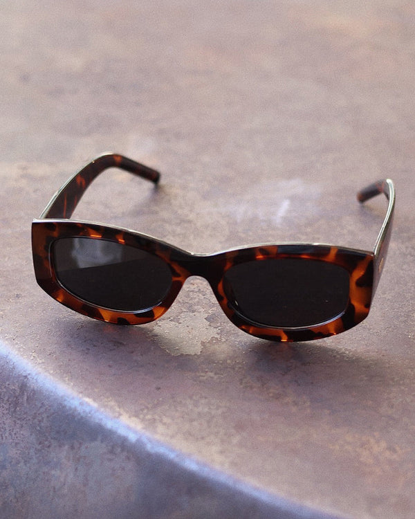 Pink Baby The Moxie sunglasses with round tinted lenses and slim metal frame, stylish eyewear for women.