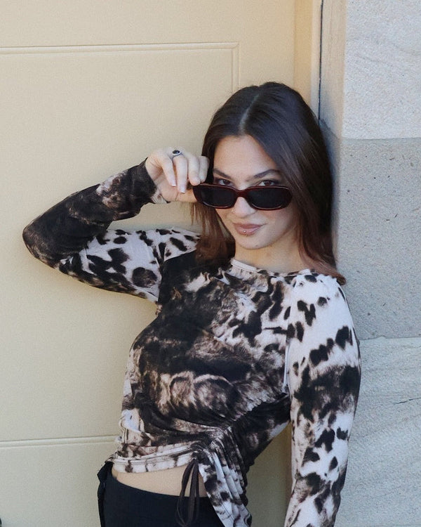 Pink Baby The Esme sunglasses with round tinted lenses and pink frames, stylish eyewear for sun protection.