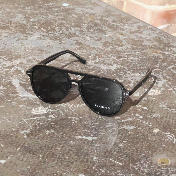 Pink Baby The Liam sunglasses with round lenses and pink frames, stylish eyewear for a fashionable look.