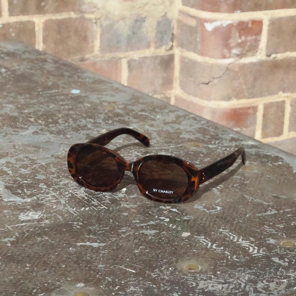 Pink Baby The Flynn sunglasses with tortoiseshell frames and dark lenses, stylish and trendy eyewear for fashion-forward wearers.