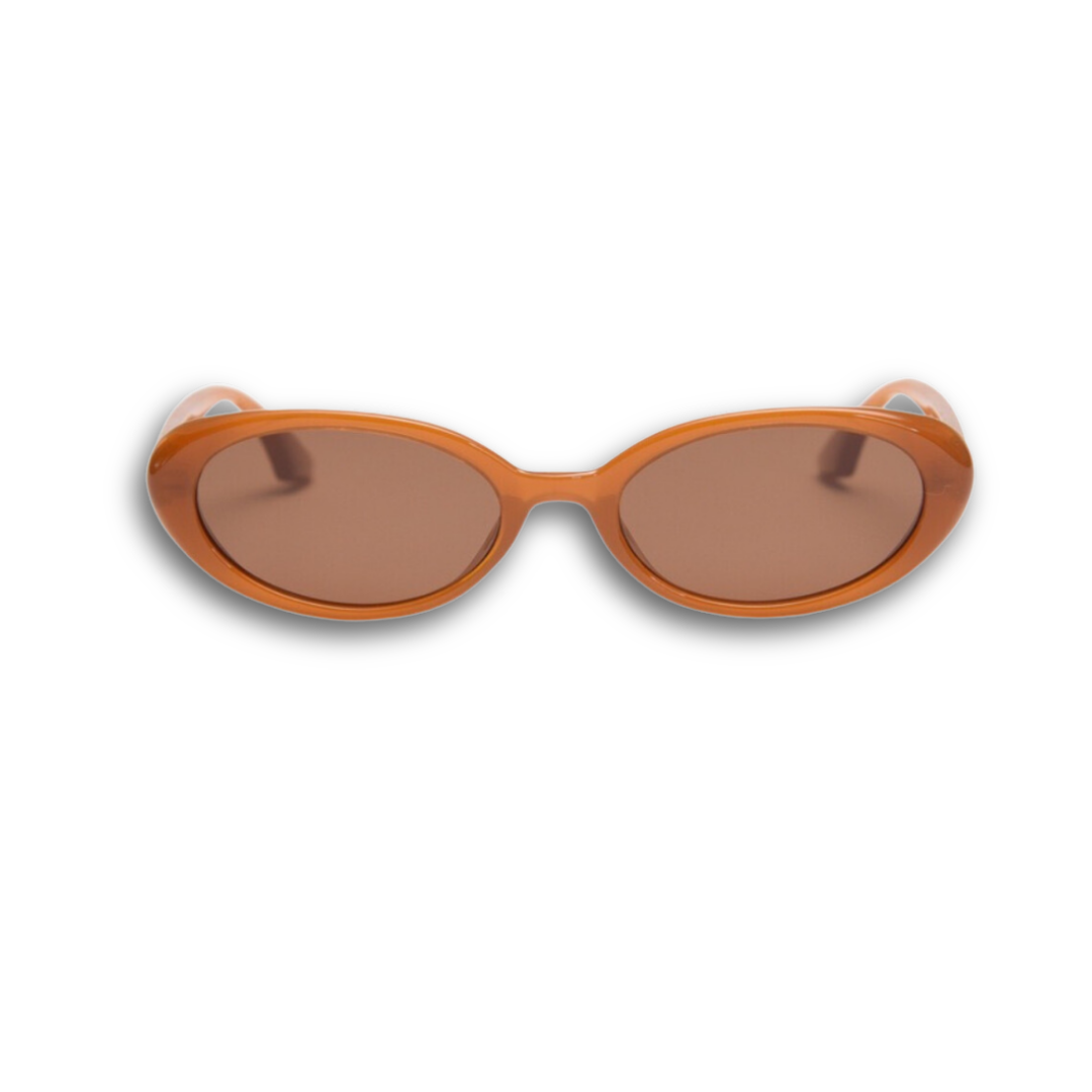 Pink Baby Kyra pumpkin-shaped polarized sunglasses with orange-tinted lenses, stylish and UV-protective for kids.