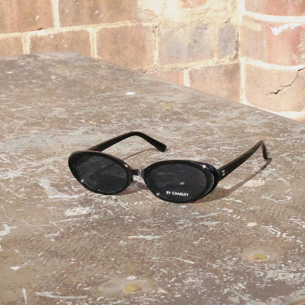 Black Pink Baby Kyra sunglasses with rounded frames and tinted lenses, stylish eyewear for fashion-forward looks.