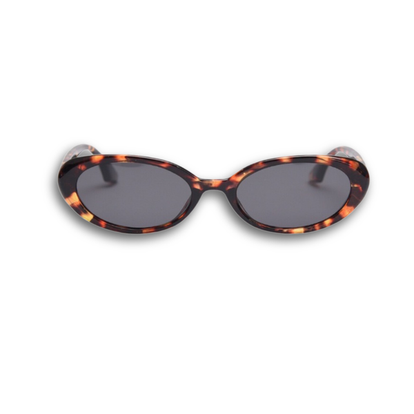 Pink Baby Kyra tort polarized sunglasses with round frames and tinted lenses, stylish eyewear for sun protection.