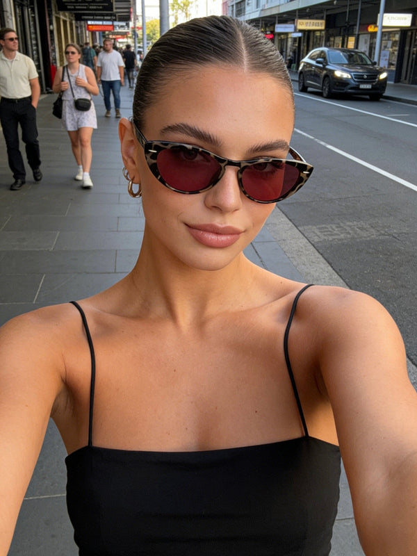 Pink Baby The Bailey tort sunglasses with stylish frame and dark lenses, designed for a trendy and fashionable look.