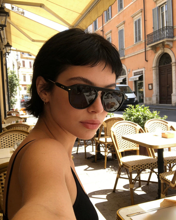 Pink Baby The Riley black sunglasses with rounded frames and dark lenses, stylish and fashionable eyewear for sun protection.