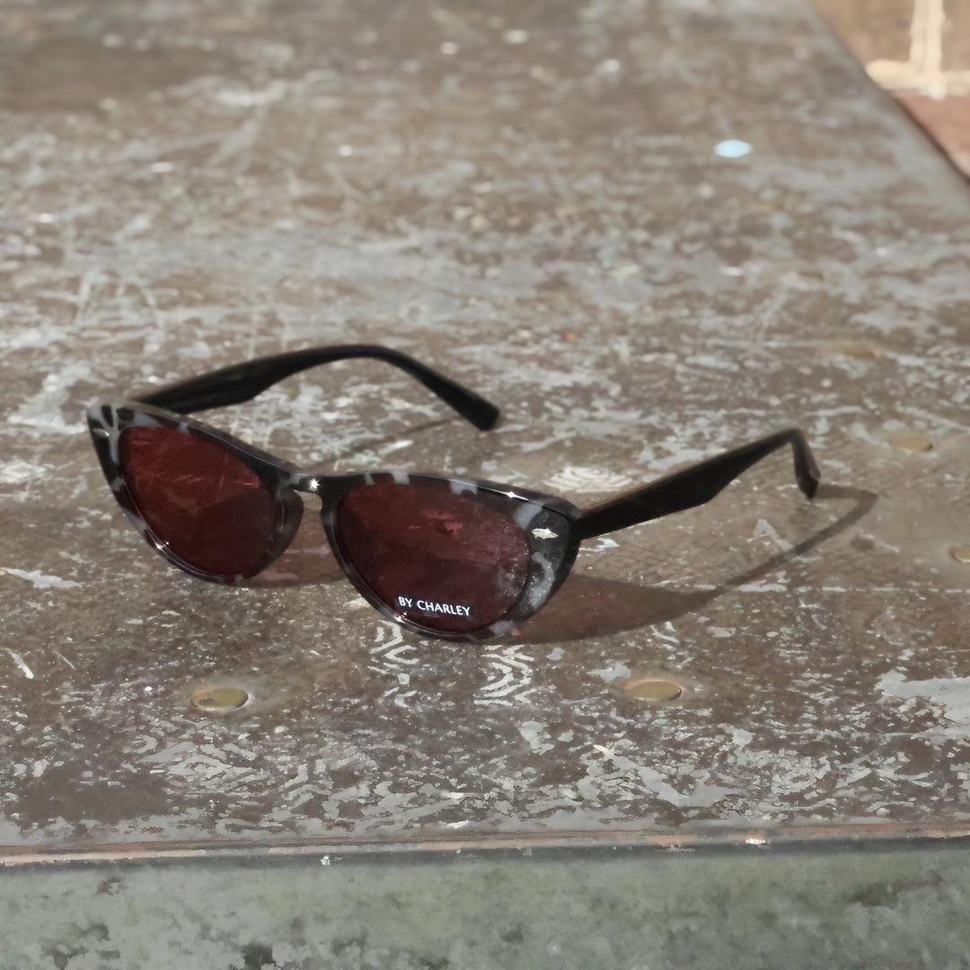 Pink Baby The Bailey tortoise-shell sunglasses with rounded frames and dark lenses, stylish eyewear for sunny days.