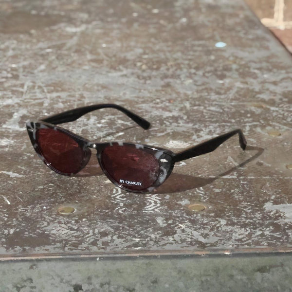 Pink Baby The Bailey tortoise-shell sunglasses with rounded frames and dark lenses, stylish eyewear for sunny days.