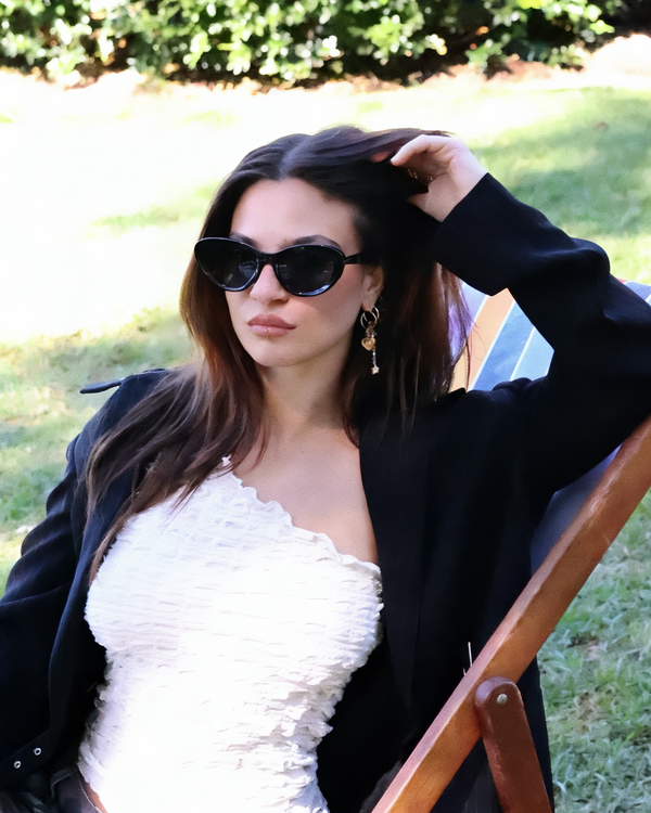 Pink Baby The Freesia black cat-eye polarized sunglasses with sleek design and tinted lenses for stylish eye protection.