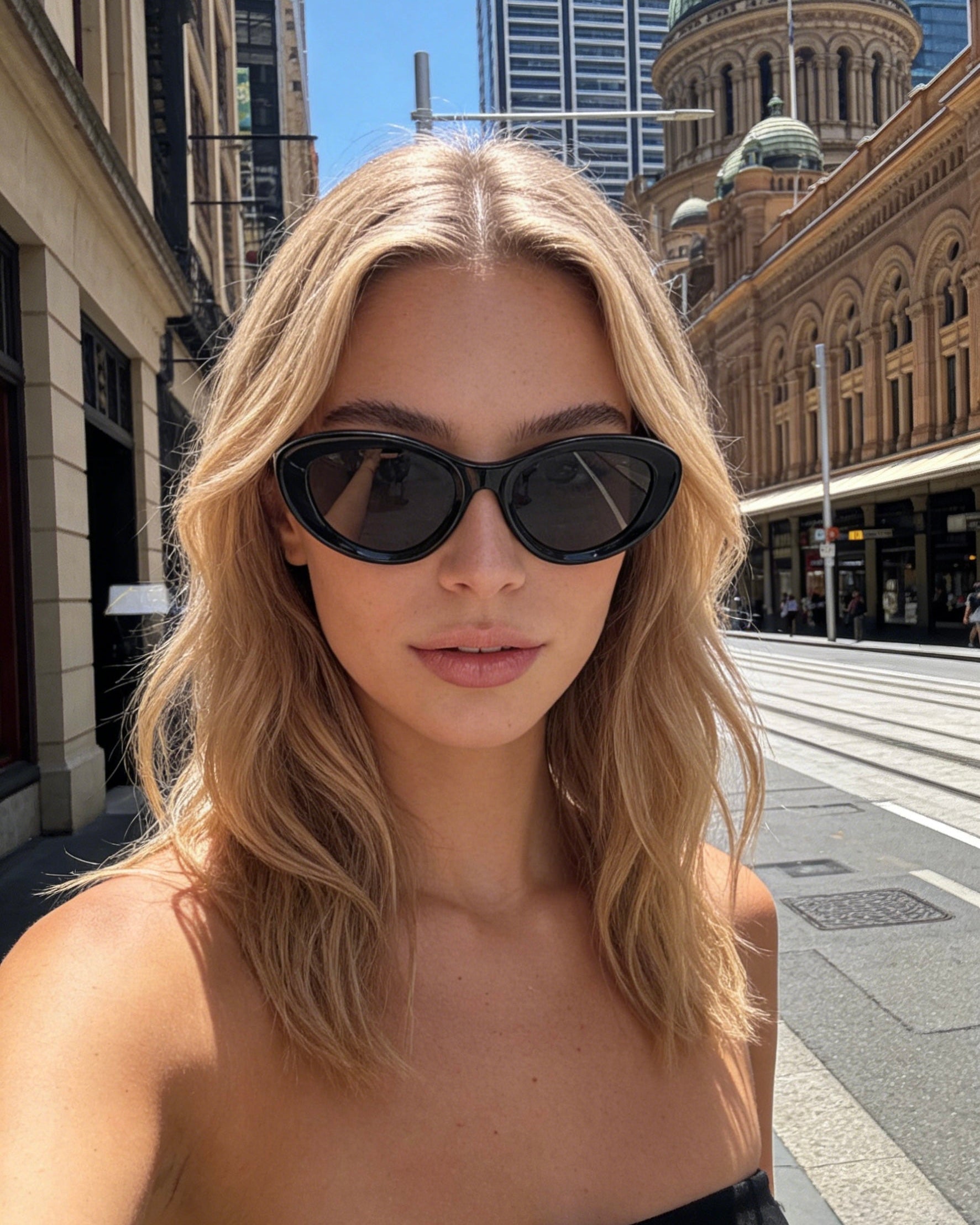 Pink Baby The Freesia black cat-eye polarized sunglasses with tinted lenses and stylish frame.