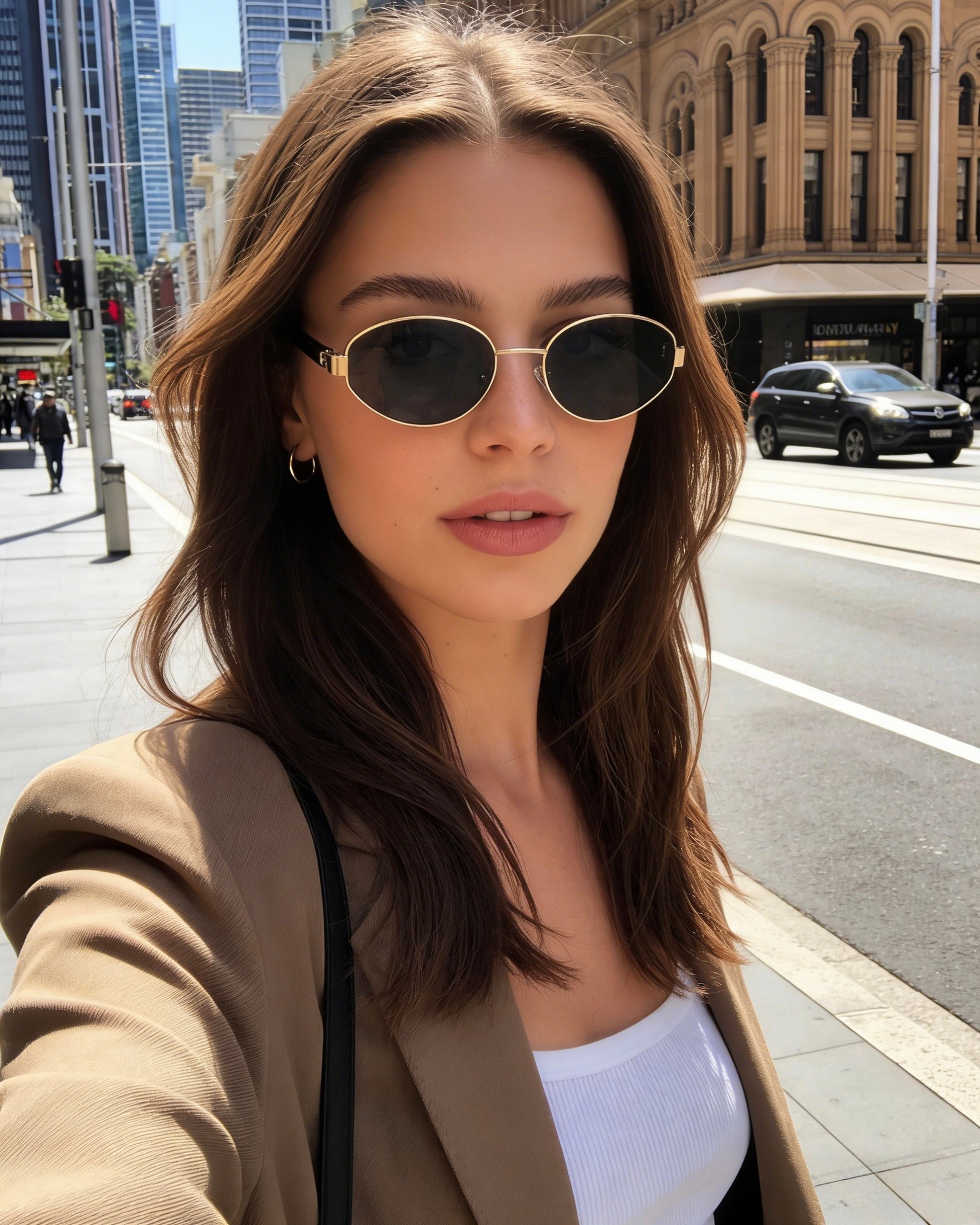 Pink Baby Hollis black oval polarized sunglasses with tinted lenses, stylish and protective eyewear for sunny days.