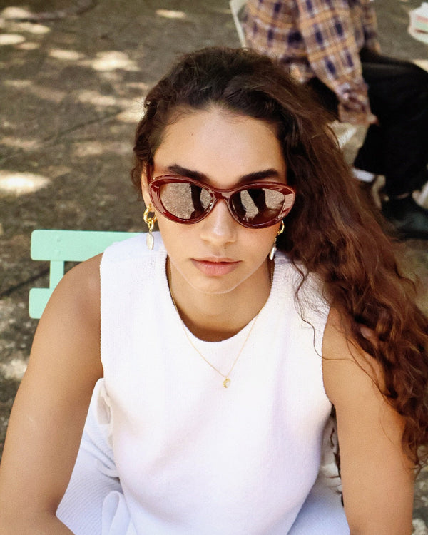 Pink Baby Freesia red cat-eye polarized sunglasses with stylish frames and tinted lenses, perfect for fashion and sun protection.