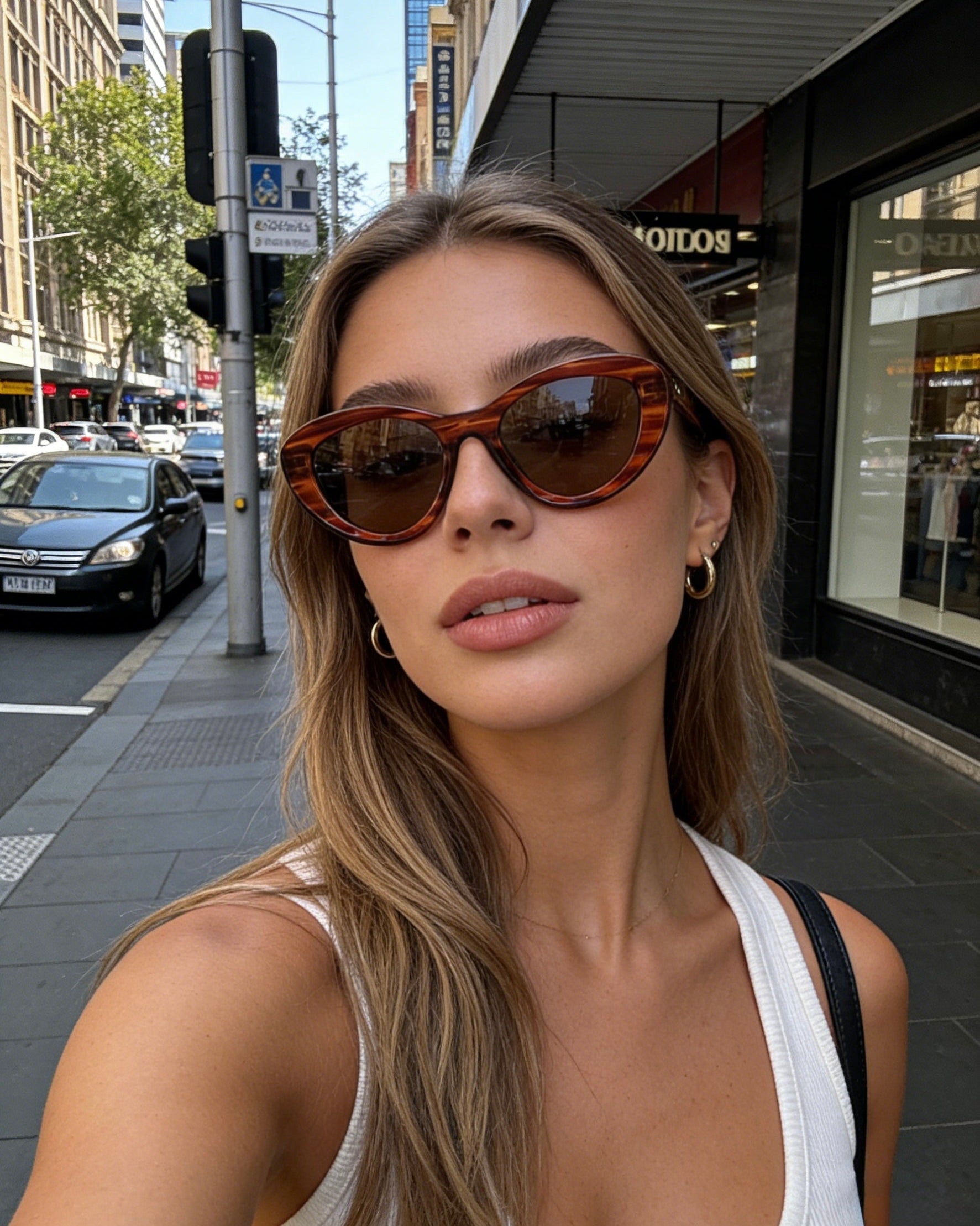Pink Baby The Freesia red cateye polarized sunglasses with dark tinted lenses and stylish frame for sun protection.
